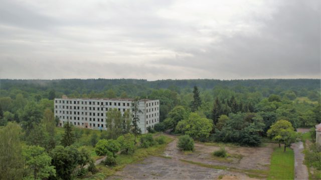 Aerial view of an abandoned apartment building in Kłomino.