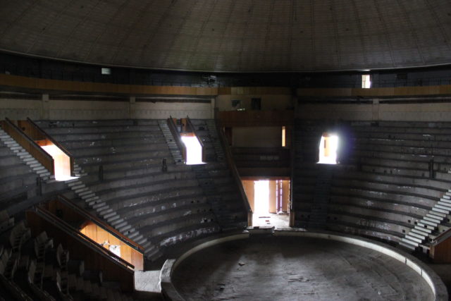 Circular arena with tiered seating.