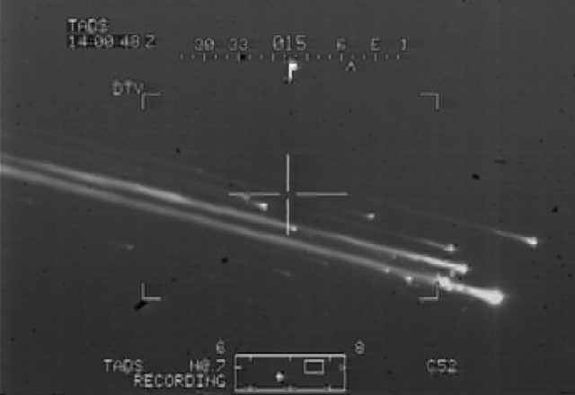 Image taken from a US Army Apache helicopter shows debris falling from the sky during Columbia re-entry 