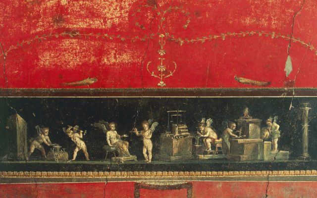 A painted panel of cupids doing everyday tasks, red paint surrounding it.
