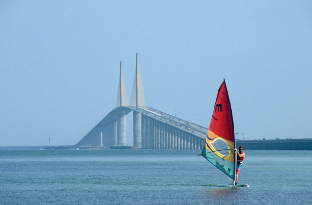 A view of the new Sunshine Skyway bridge in Tampa Bay, a para-sailor in the foreground.
