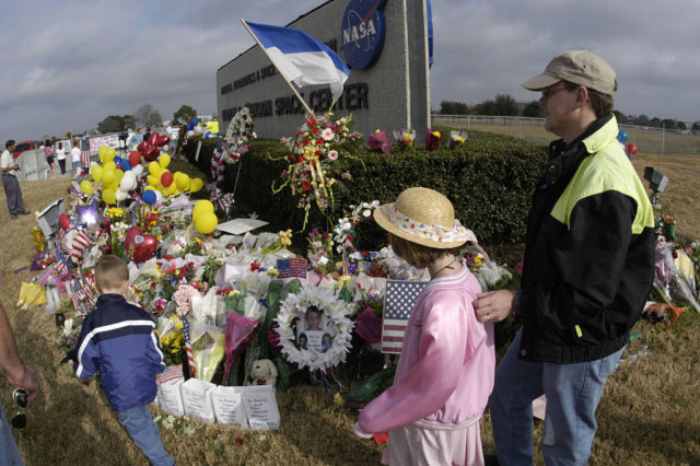 A large memorial of flowers and balloons outside Johnson Space Center following the Columbia disaster