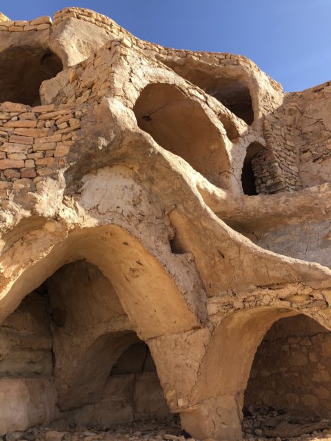 Unique stone archways growing up a mountain