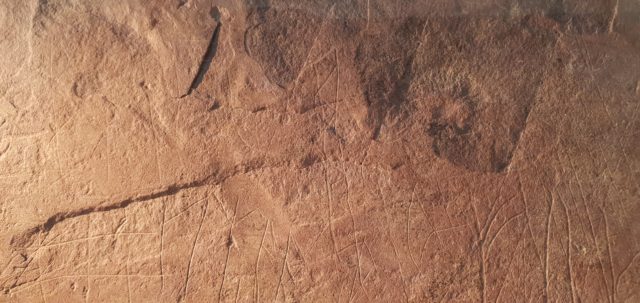 Runes markings on a sandstone slab