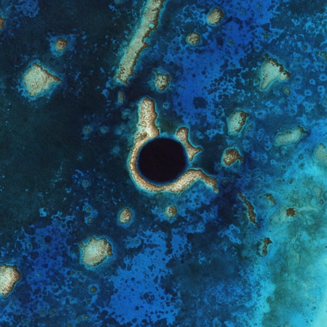 An aerial view of the Great Blue Hole in Belize.