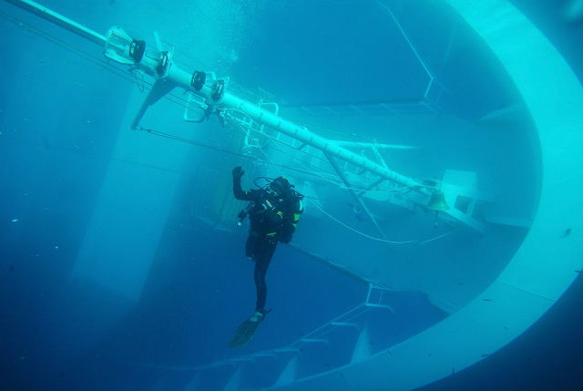 Diver underwater exploring the Costa Concordia.