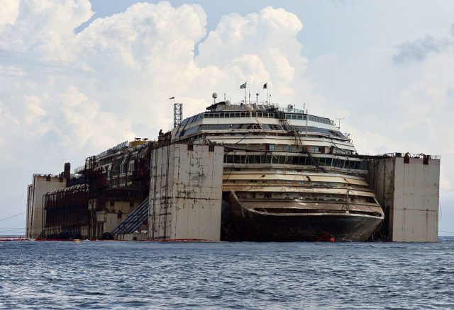 The Costa Concordia docked in the water.