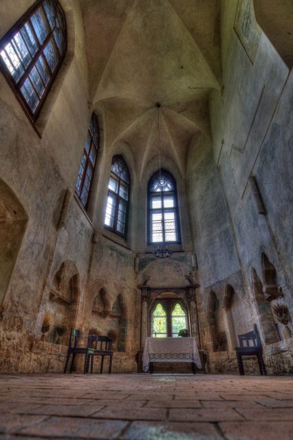 Floor to ceiling view of a chapel interior. 