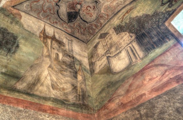 View looking up at a painting on the ceiling of Houska Castle.