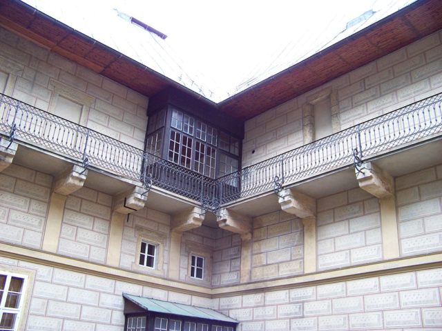 Balcony with a window box sticking out. 