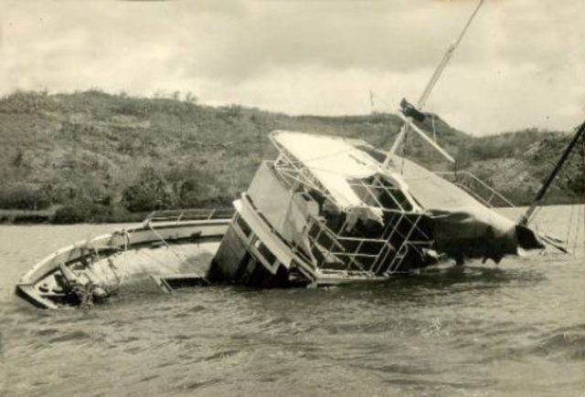 MV Joyita half sunk on its side.