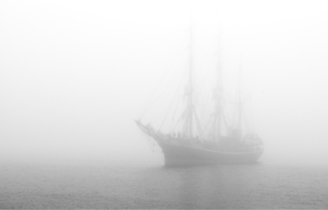 Ship sailing in heavy fog.