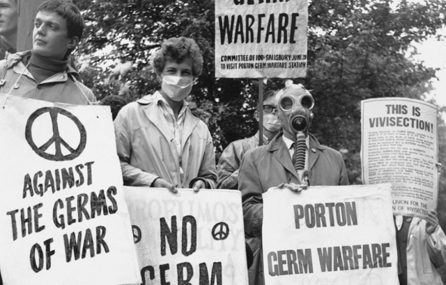 Group of protestors holding anti-Porton Down signs.