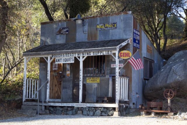 Old, general store-style building, with Rough and Ready Mining Supplies and Antiques signs. 