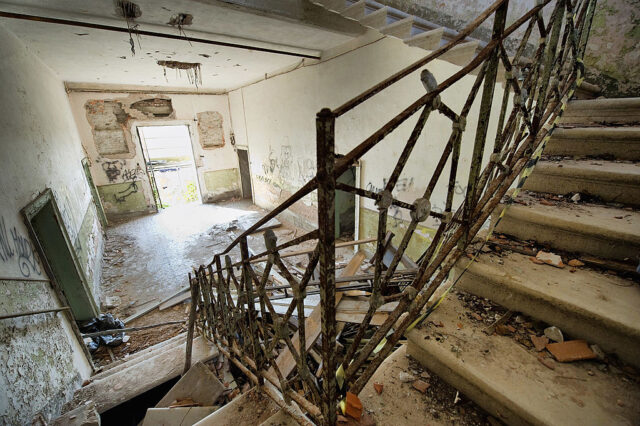 Staircase strewn with debris