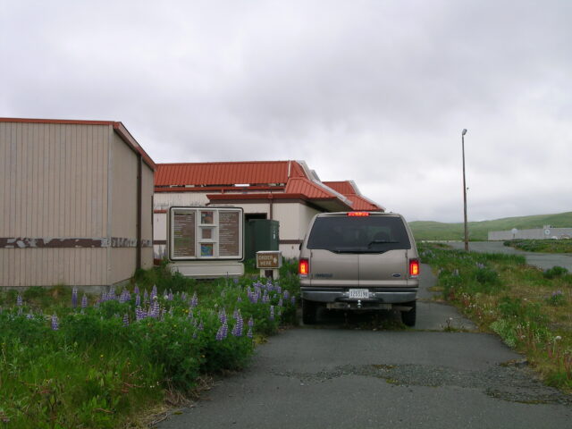 Car moving through the drive-thru of the abandoned McDonald's near the Adak Army Base and Naval Air Facility