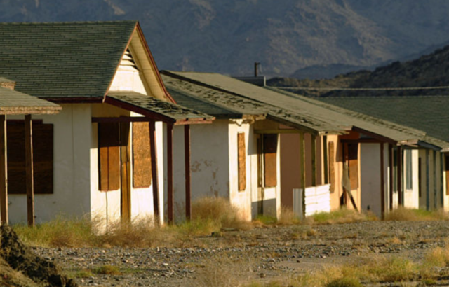 Boarded-up houses along a street in Eagle Mountain