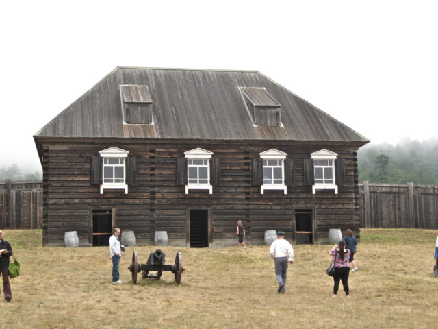 The Rotchev House with tourists walking around the building and compound.