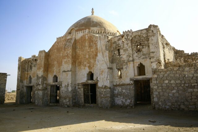 A decaying building with a domed roof.