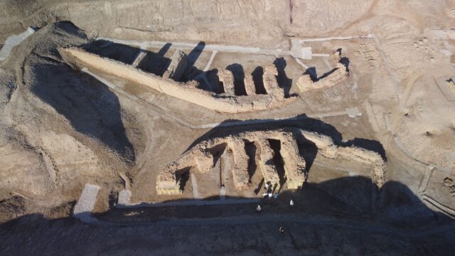 Aerial view of a dig site with walls unearthed.