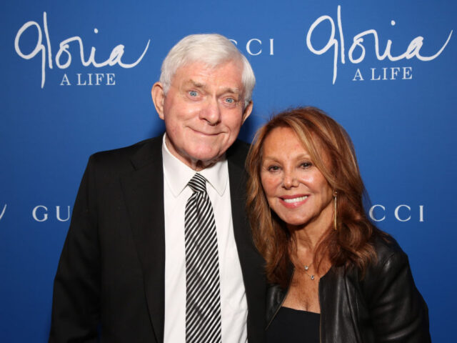 Phil Donahue and Marlo Thomas standing together on a red carpet