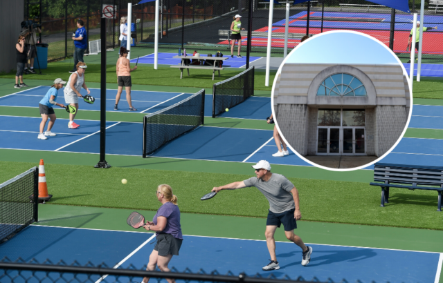 Several pickleball courts with people playing on them, an abandoned mall entrance on top