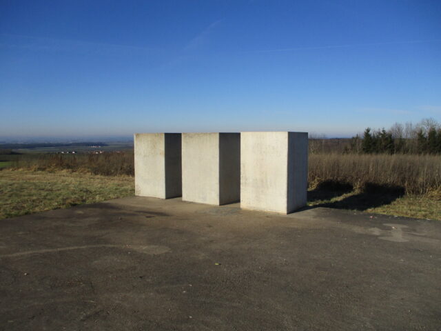 Three concrete blocks on a concrete slab