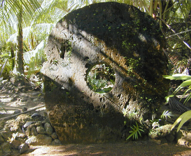 Tall circular stone with a small hole cut in the center.