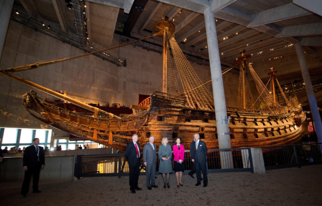Robert Olsson; then-Prince Charles; Camilla, Duchess of Cornwall; King Carl XVI Gustaf; and Queen Silvia standing in front of Vasa