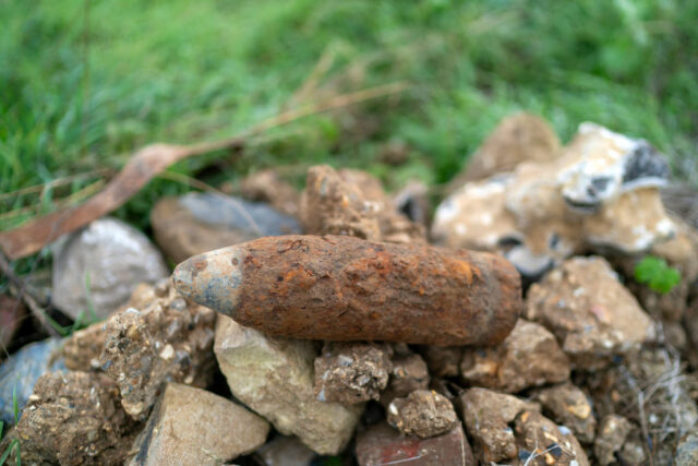 World War I-era artillery piece placed on a pile of stones