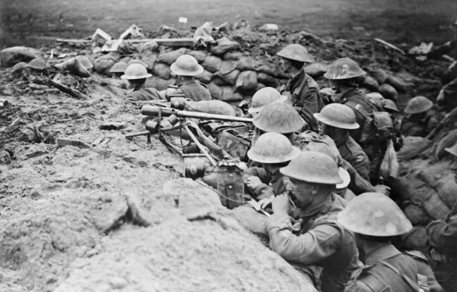 British soldiers aiming their weapons from a trench
