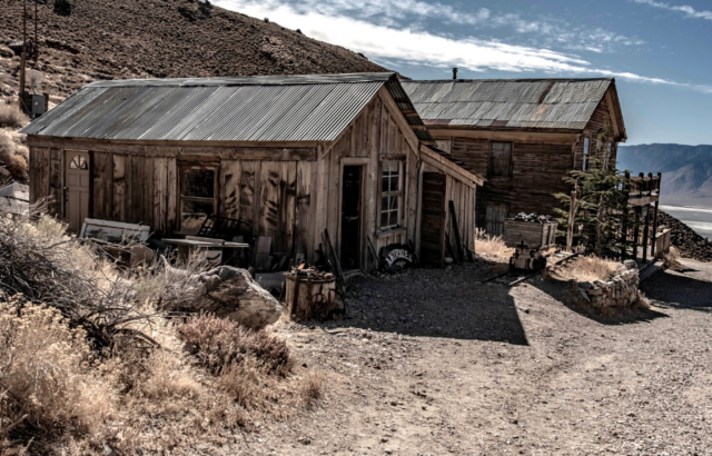 Two derelict buildings side-by-side.