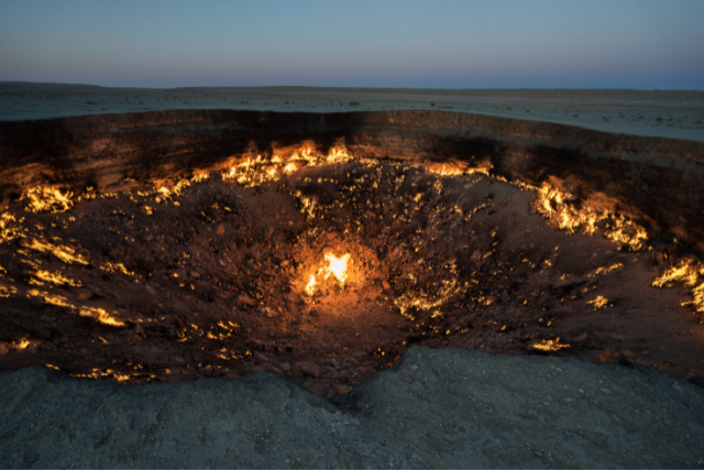 Turkmenistan's Gates of Hell in a dark setting.