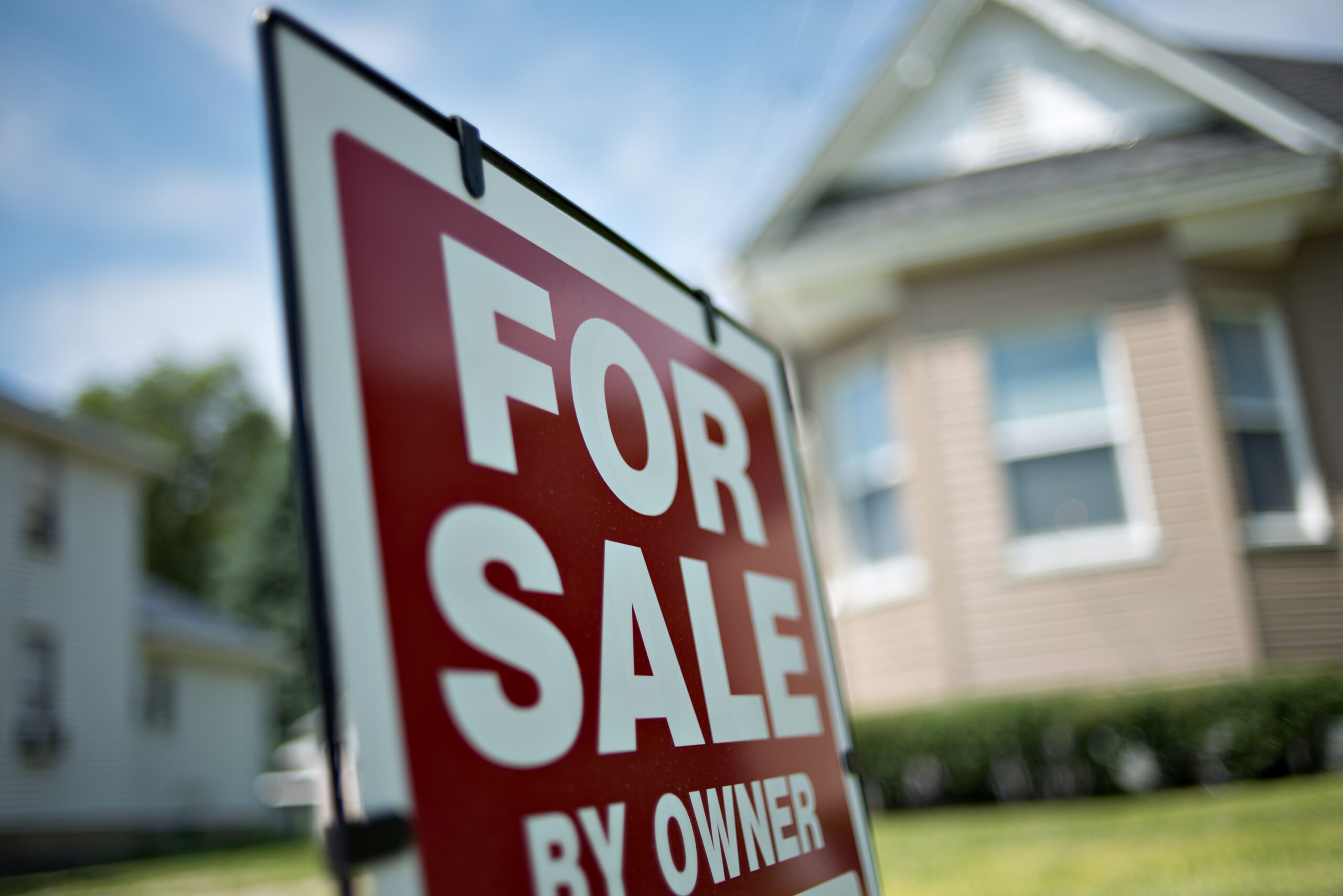 A for sale sign outside of a home.