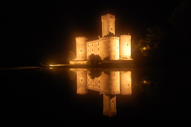 Montbrun Castle lit up at night