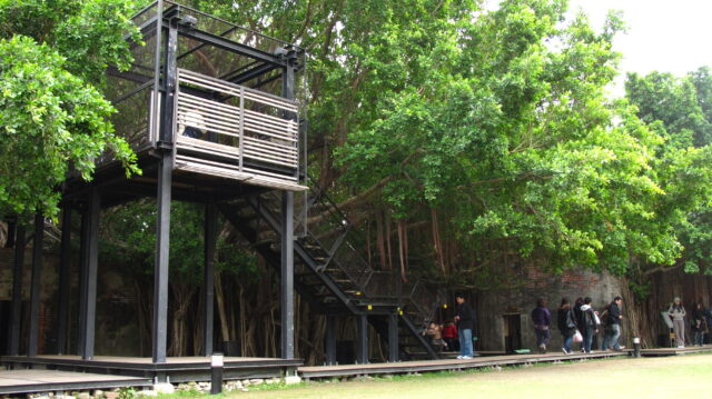 A metal staircase leading up to Anping Tree House.