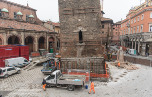 The base of Garisenda Tower surrounded by construction.