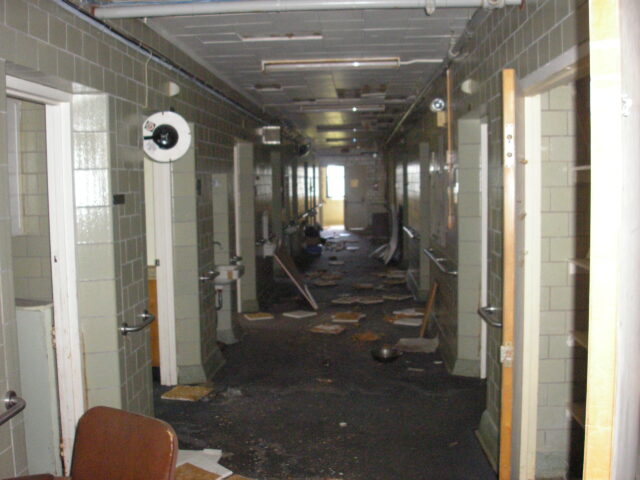 A hallway with debris.