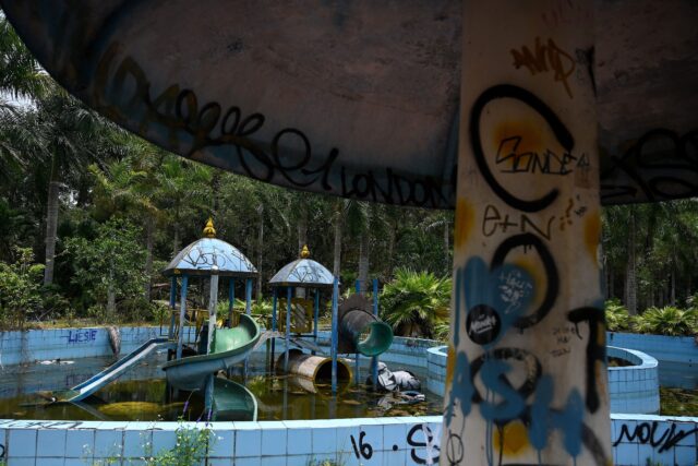 Graffiti-covered water attractions at Hồ Thuỷ Tiên waterpark