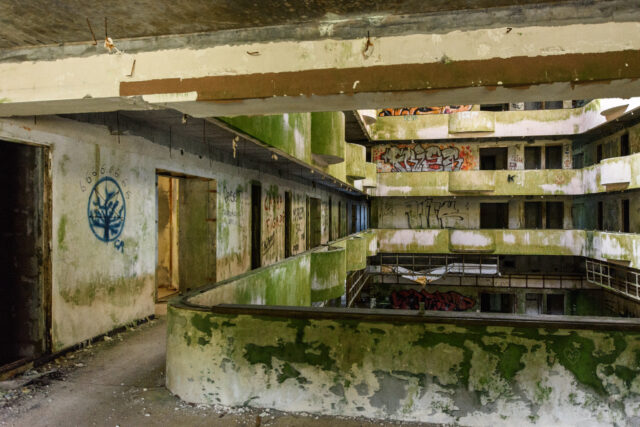 Decrepit concrete hallways in a hotel. 