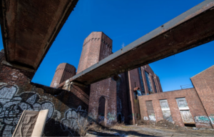 A low shot of an abandoned brick building.