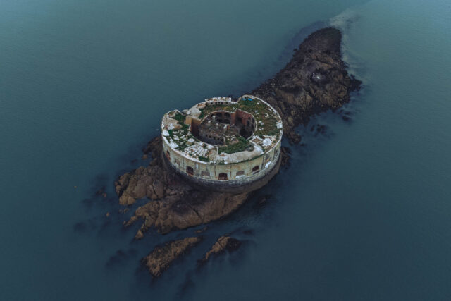 Aerial view of a fort surrounded by water on all sides.